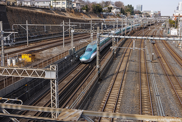 JR East E5 shinkansen surfacing at Nippori